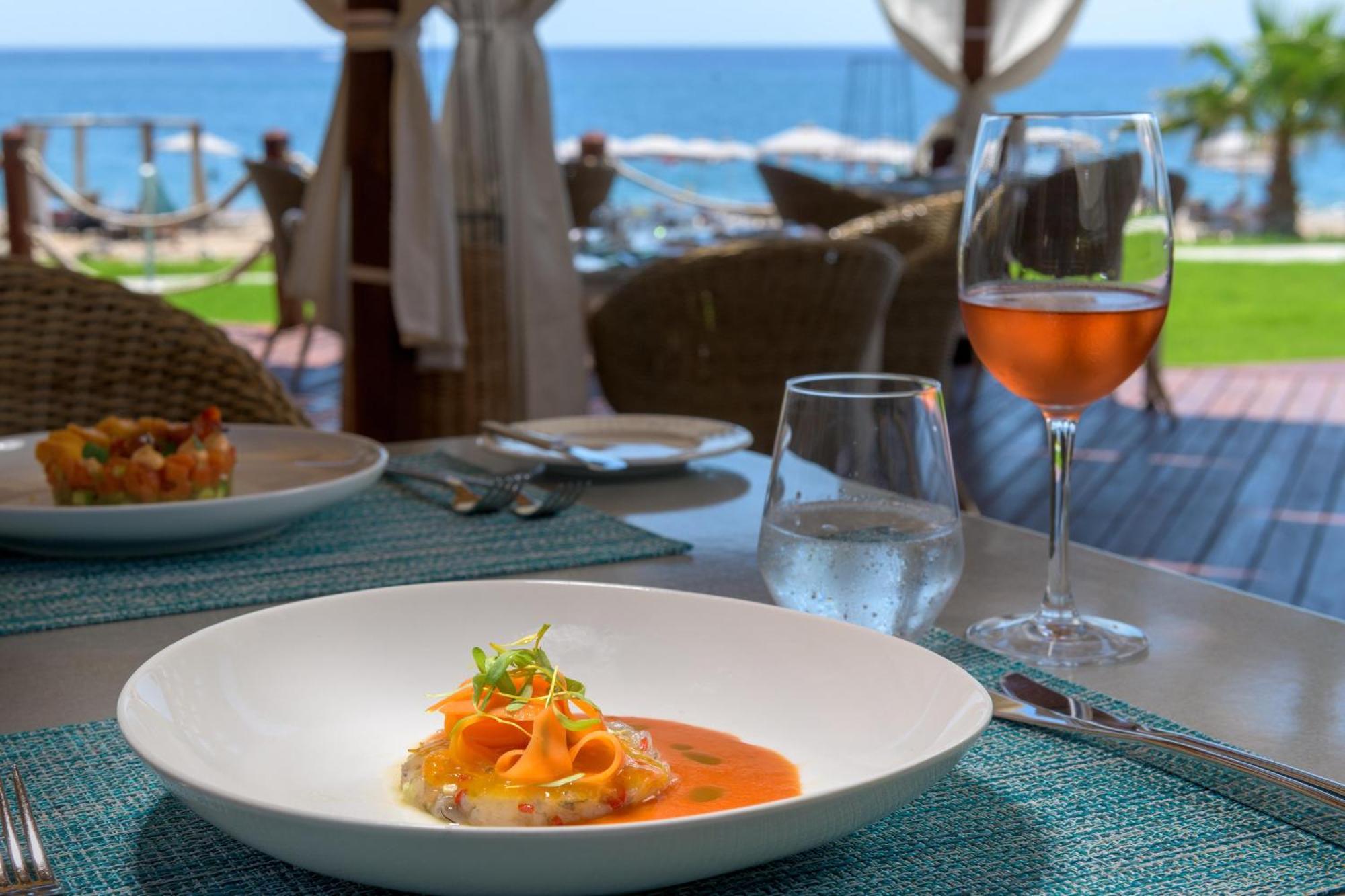 Rodos Palladium Leisure & Wellness Kallithea  Exterior photo A glass of rosé wine